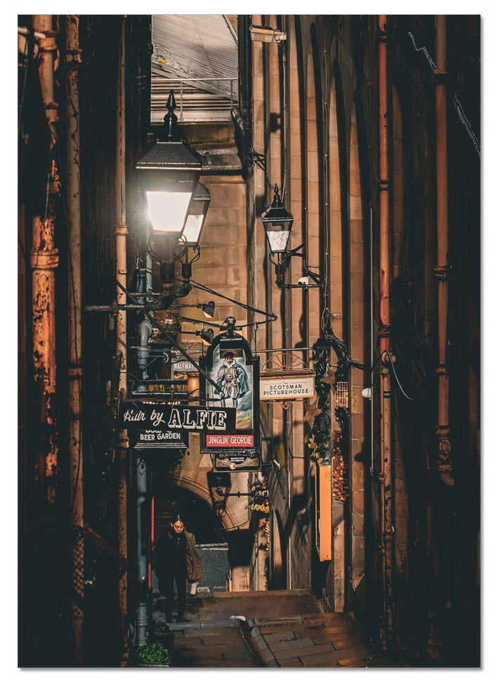 Atmospheric fine art photography of a figure walking through an Edinburgh close. A study in light, shadow and quiet movement from the Light & Shadow collection.