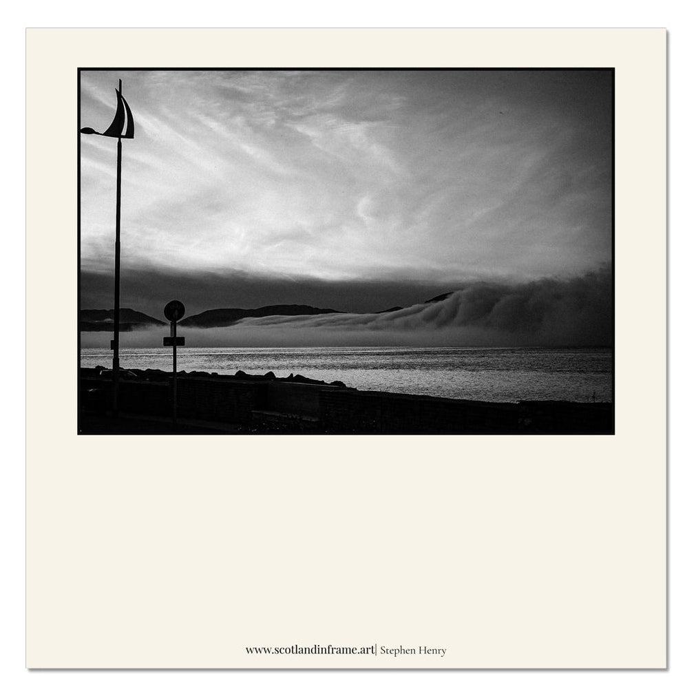Contemporary photograph of the view across the Firth of Clyde as a Cloud inversion, resembling a wave, moves down the Clyde.
