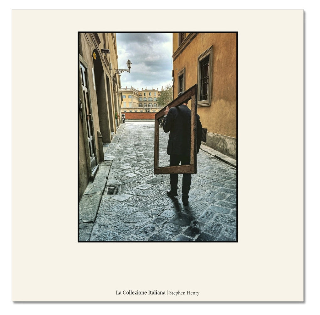 Fine art travel photograph of a someone carrying an empty frame in Florence, Italy, part of the La Collezione Italiana wall art collection.