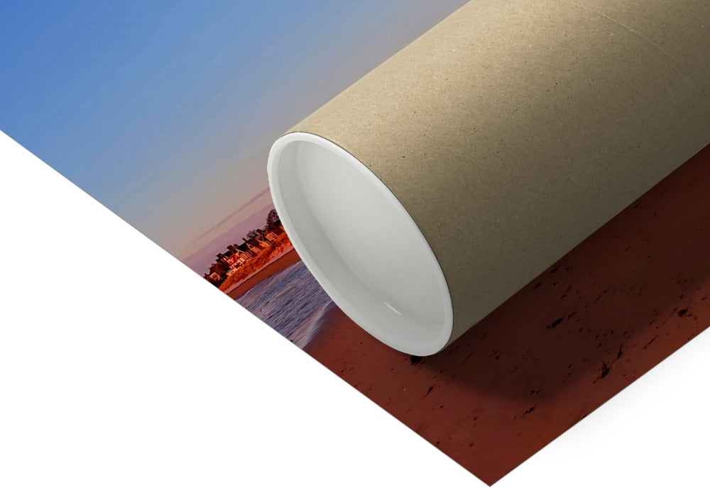 Beach and village edge at Earlsferry, Fife, with houses catching early light and the moon visible, completing a four-image panoramic coastal photograph.