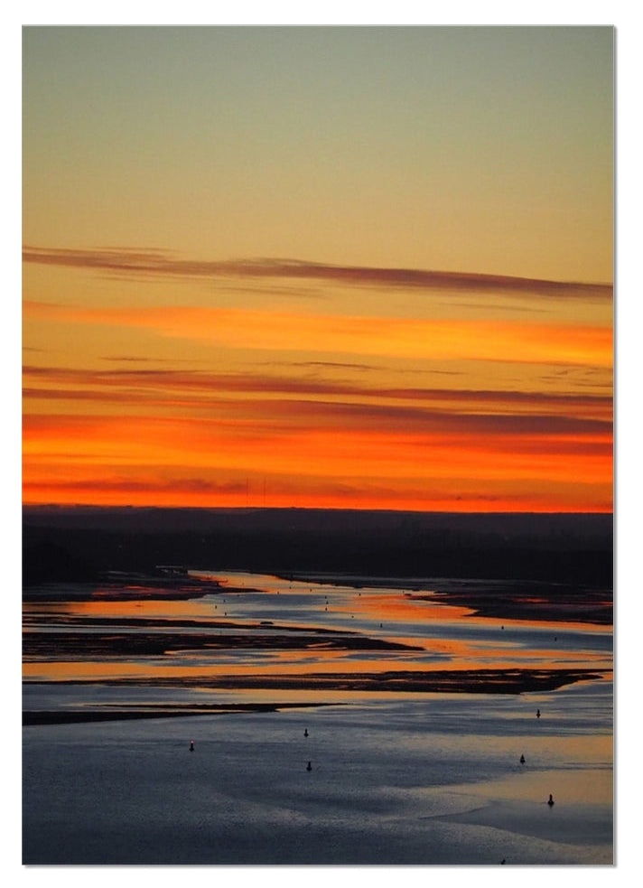 Pre-sunrise light colouring the sky over the River Clyde, looking towards Glasgow from Gourock, Scotland