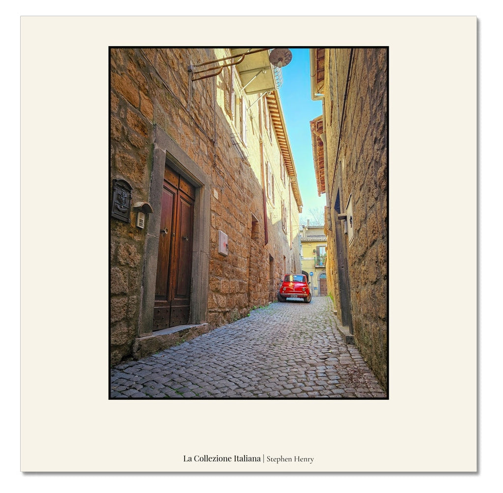 Fine art travel photograph of an original red Fiat 500 in Orvieto, Italy, part of the La Collezione Italiana wall art collection.