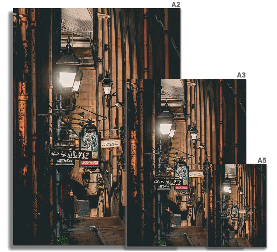 Atmospheric fine art photography of a figure walking through an Edinburgh close. A study in light, shadow and quiet movement from the Light &amp; Shadow collection.