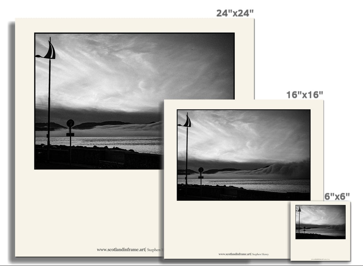 Contemporary photograph of the view across the Firth of Clyde as a Cloud inversion, resembling a wave, moves down the Clyde.