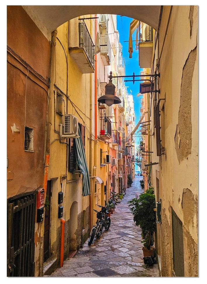 Sotto l’Arco fine art photograph looking through an old archway into a colourful narrow Italian street