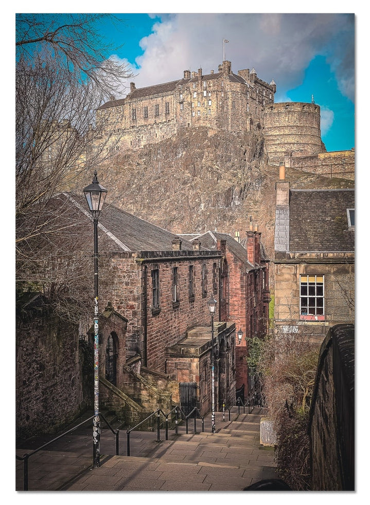 The Vennel, Edinburgh with the iconic Castle rising beyond, captured in atmospheric light for this fine art photography print from the Light &amp; Shadow collection.