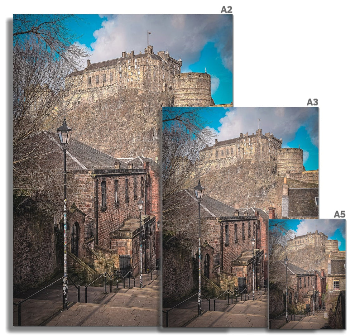 The Vennel, Edinburgh with the iconic Castle rising beyond, captured in atmospheric light for this fine art photography print from the Light &amp; Shadow collection.