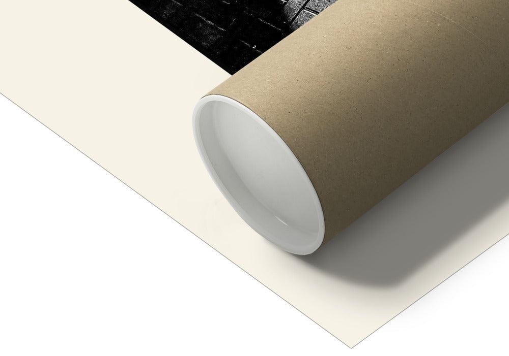 Contemporary photograph of the view through a rectangular window as the Sun was rising. Throwing light onto a brick floor.